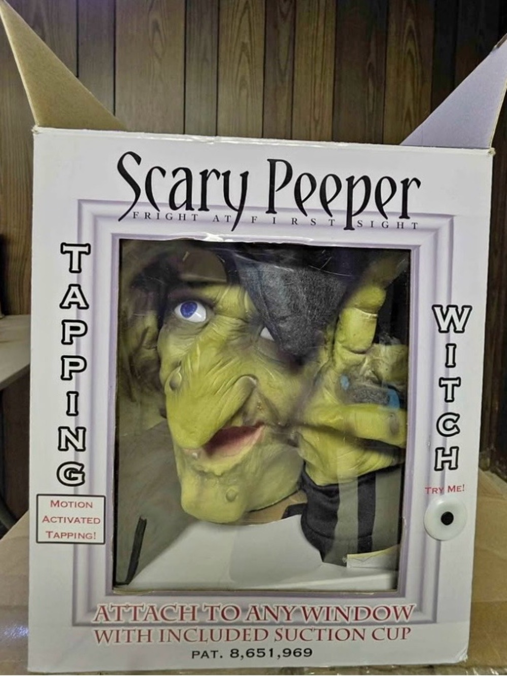 Scary Peeper Witch Tapping Window Prop works well placed on a glass window/door
